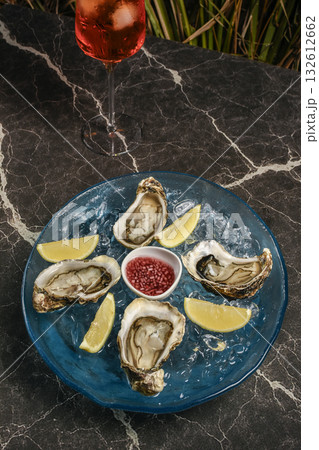 fresh galician raw oysters on ice in gourmet vigo restaurant table in spain fresh galician raw oysters on ice in gourmet vigo restaurant table in spain 132612662