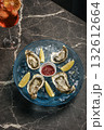 fresh galician raw oysters on ice in gourmet vigo restaurant table in spain 132612664
