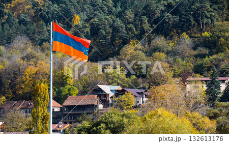 Armenian flag flying in the air 132613176