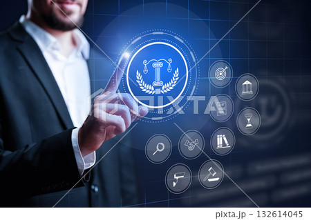 Business professional engaging with legal technology icons in a modern digital workspace 132614045