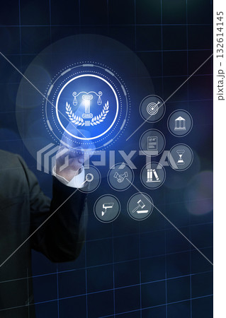 Lawyer using digital interface to explore legal symbols in a modern office setting 132614145