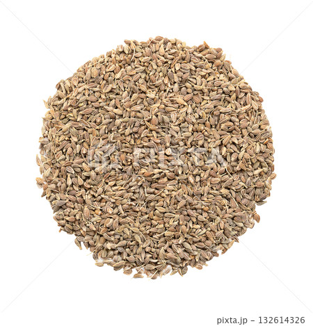 Aniseed, anise seeds, shaped into a circle, isolated from above, on white background. Anise fruits, mistakenly called seeds, from Pimpinella anisum, used to flavor food, candy, and alcoholic drinks. 132614326
