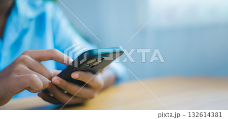 Close-up hand using smartphone for communication and business technology concept 132614381