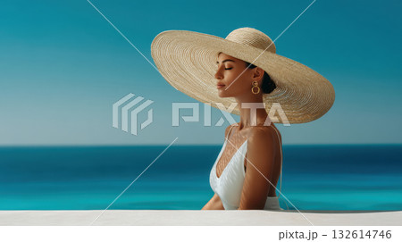Woman in large hat by the sea Woman in large hat by the sea 132614746