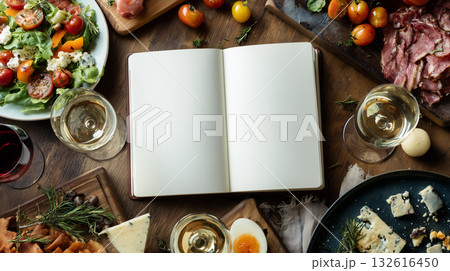 Gathering around food and drinks at a festive table with an open notebook 132616450
