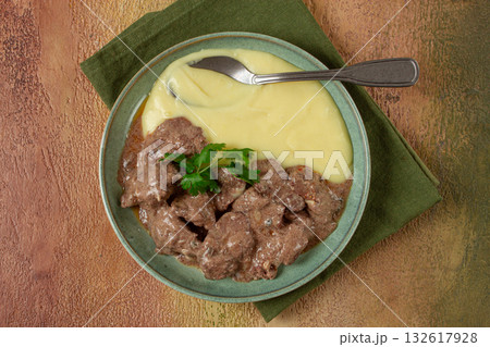 liver beef stroganoff with mashed potatoes, table setting in green tones, homemade, liver beef stroganoff with mashed potatoes, table setting in green tones, homemade, 132617928