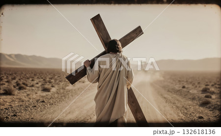 The martyr Christ carries a heavy cross along the deserted road to Golgotha. The martyr Christ carries a heavy cross along the deserted road to Golgotha. 132618136