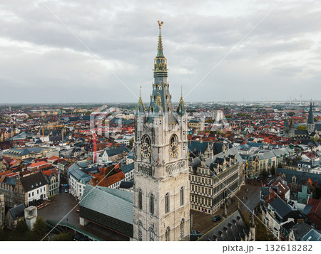 Aerial panorama of Ghent featuring the iconic Belfry tower and the rooftops of the old city. 132618282
