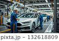 Manufacturing engineers monitor the assembly process of a car on a production line in a car assembly plant 132618809