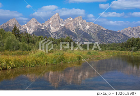 Teton Range reflecting in Snake River at Schwabacher Landing at Grand Teton National Park in Wyoming, USA Teton Range reflecting in Snake River at Schwabacher Landing at Grand Teton National Park in Wyoming, USA 132618987