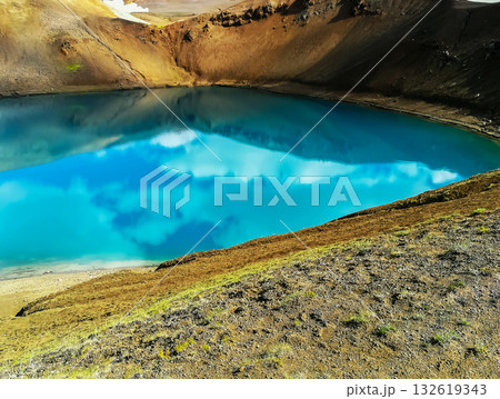 Blue lagoon in the crater of the Vti volcano, over 300 meters in diameter, in Iceland 132619343