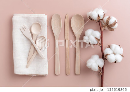 Eco friendly cutlery, cotton napkin, wooden spoon, fork, knife, and cotton branch arranged on pastel background, promoting sustainable lifestyle and natural materials Eco friendly cutlery, cotton napkin, wooden spoon, fork, knife, and cotton branch arranged on pastel background, promoting sustainable lifestyle and natural materials 132619866