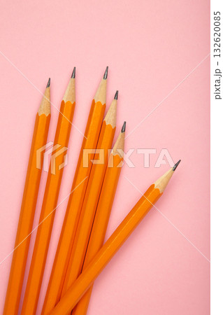 Graphite pencil with eraser on pink background. School stationery 132620085