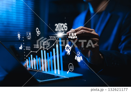 Businessman analyzing digital bar chart with rising trend from 2022 to 2026. Concept of business growth, success strategy, data analytics, and futuristic planning in corporate development. Businessman analyzing digital bar chart with rising trend from 2022 to 2026. Concept of business growth, success strategy, data analytics, and futuristic planning in corporate development. 132621177