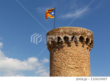Stone tower with Catalonia flag in Tossa de Mar Spain 132624007