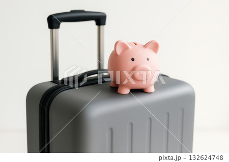 Pink piggy bank resting on a modern travel suitcase symbolizing savings, budget friendly trips, and efficient financial planning, AI Generative 132624748