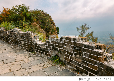Aerial view of Simatai section of Great Wall of China in its original, un-restored state. Watchtowers perched on mountain peaks, Beijing, China. High quality photo 132626421