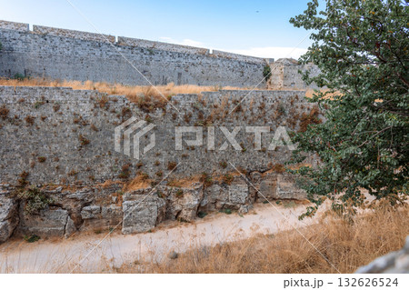 Stone powerful walls of old city, the ancient defense of Old Town, Rhodes, Dodecanese, Greece. High quality photo 132626524