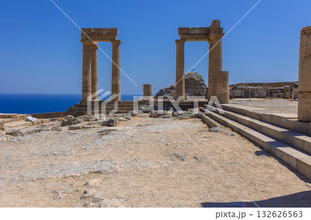 Panoramic view of ruins of ancient city of Lindos on colorful island of Rhodes, Greece. Famous tourist attraction. Ancient temple Greek architecture. High quality photo 132626563