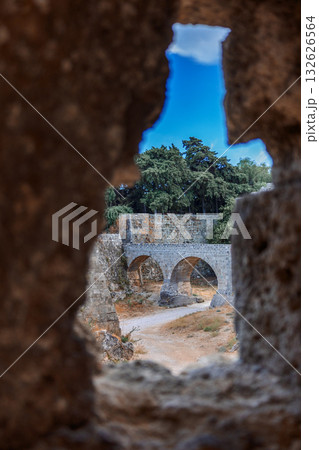Stone powerful walls of old city, the ancient defense of Old Town, Rhodes, Dodecanese, Greece. High quality photo 132626564