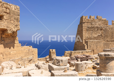 Panoramic view of ruins of ancient city of Lindos on colorful island of Rhodes, Greece. Famous tourist attraction. Ancient temple Greek architecture. High quality photo 132626590