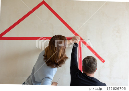 Man hugging his wife. Young couple moving in new apartmen. View from side. Concept new homes, new beginning. High quality photo 132626706