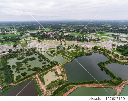 The aerial view of many ponds and paths near the manufactory shot by drone. 132627130