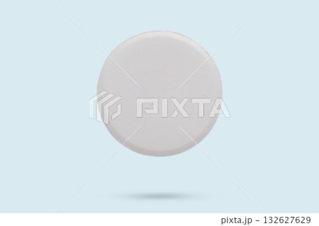White medicine pill tablet flying on background 132627629