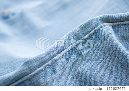Old denim blue jeans fabric texture background close up Old denim blue jeans fabric texture background close up 132627671