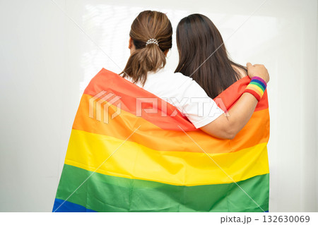 Asian couple woman with LGBT rainbow flag. 132630069