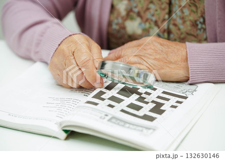 Bangkok, Thailand - May 15, 2022 elderly woman playing sudoku puzzle game. 132630146