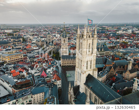 Aerial footage showcasing Ghents gothic towers and dense urban heritage below 132630465