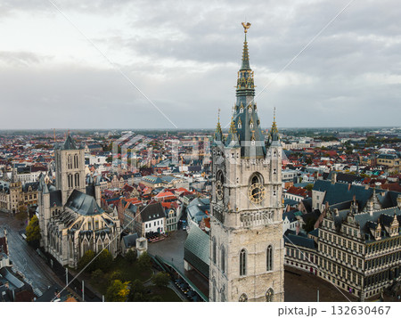 Expansive drone view capturing the skyline of Ghent with its famous medieval towers. 132630467