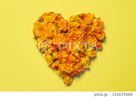 beautiful heart shape of yellow roses on a bright yellow background beautiful heart shape of yellow roses on a bright yellow background 132635089