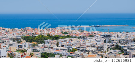 Panoramic view of the Greek city of Rethymno from a height on the island of Crete Greece. Residential buildings and the Aegean sea Panoramic view of the Greek city of Rethymno from a height on the island of Crete Greece. Residential buildings and the Aegean sea 132636981