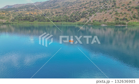 Family riding pedal boat on freshwater Kournas Lake near Georgioupoli in Crete. 132636985