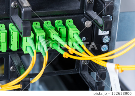 Fiber Optic cables connected to an optic ports 132638900