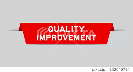 Red color inserted label with word quality improvement on gray background 132640754