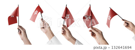 The Hong Kong flag in hand in different angles on a white background 132641694