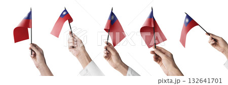 The Taiwan flag in hand in different angles on a white background 132641701