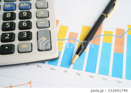 Calculator on chart graph paper. Finance, account, statistic, investment data economy, stock exchange business. Calculator on chart graph paper. Finance, account, statistic, investment data economy, stock exchange business. 132641746