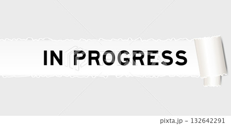 Ripped gray paper background that have word in progress under torn part 132642291