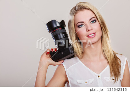 Beautiful woman with camera. 132642516