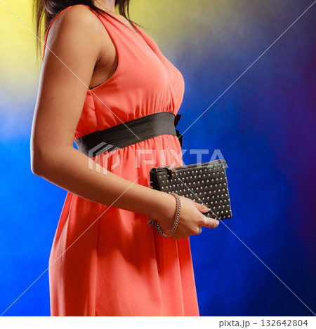 Evening handbag in woman hand Evening handbag in woman hand 132642804