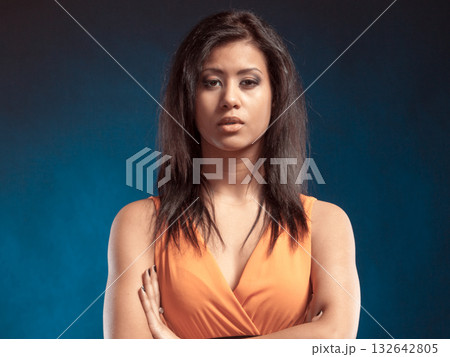 mixed race girl portrait on blue 132642805