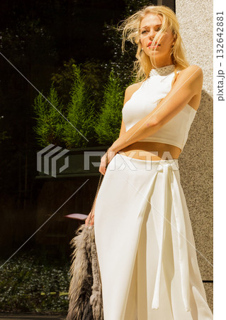Woman wearing crop top and culottes Woman wearing crop top and culottes 132642881