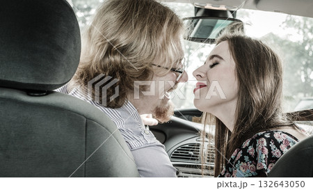 Man and woman kissing in car Man and woman kissing in car 132643050