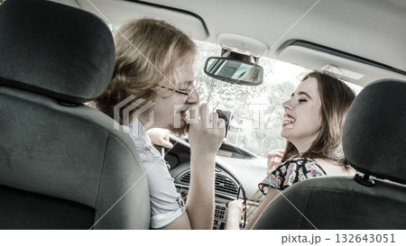Happy man and woman in car Happy man and woman in car 132643051