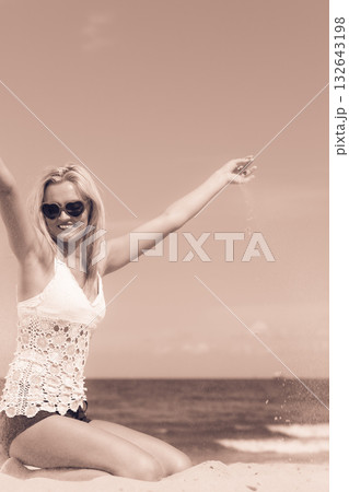 Pretty girl on beach. 132643198
