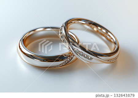 Pair of white gold wedding rings on a white background. 132643879